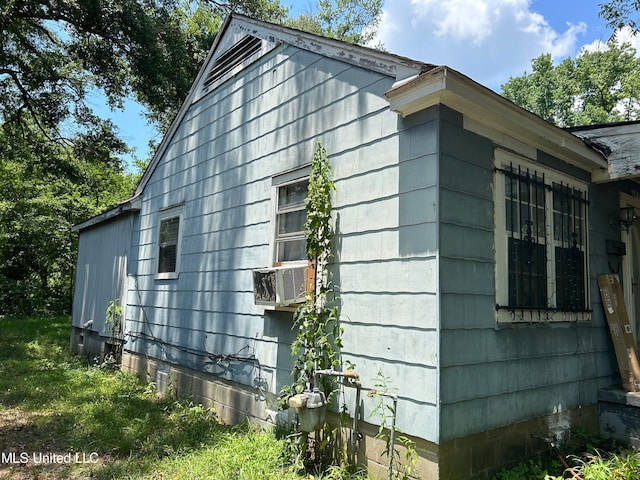 view of home's exterior featuring cooling unit