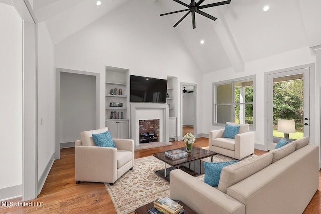 103 Grayson Way, Madison, MS 39110 - living room with high vaulted ceiling, ceiling fan, light wood-style floors, a fireplace with raised hearth, and recessed lighting