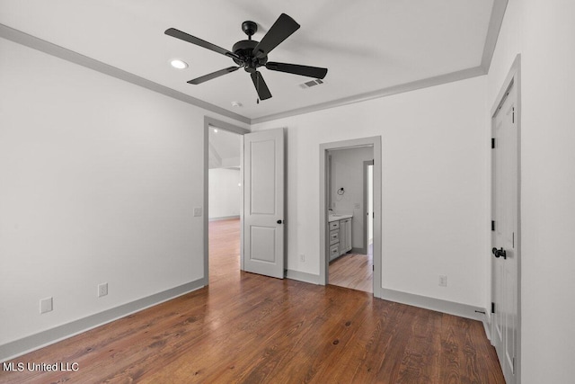 unfurnished bedroom with ensuite bathroom, ceiling fan, and dark hardwood / wood-style floors