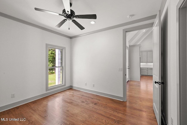 unfurnished room with hardwood / wood-style floors and ceiling fan