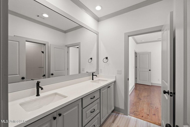 103 Grayson Way, Madison, MS 39110 - full bathroom with double vanity, wood finished floors, baseboards, recessed lighting, and crown molding