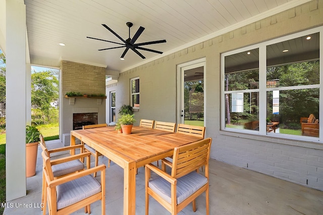 103 Grayson Way, Madison, MS 39110 - view of patio / terrace with exterior fireplace, outdoor dining area, and ceiling fan