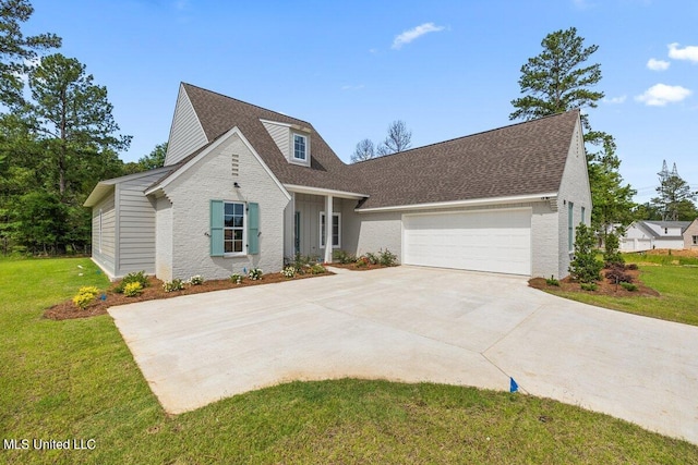 view of front of home featuring a garage and a front lawn