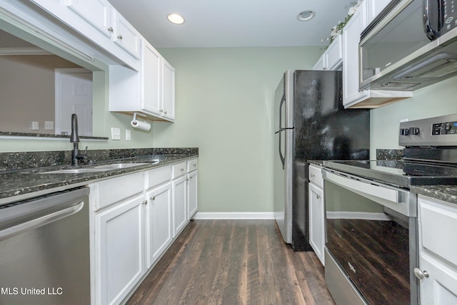 2421 Beachview Dr Unit H2, Ocean Springs, MS 39564 - kitchen featuring appliances with stainless steel finishes, white cabinets, dark stone counters, and recessed lighting
