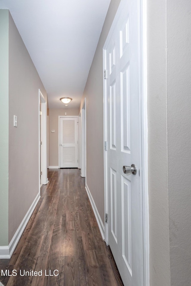 2421 Beachview Dr Unit H2, Ocean Springs, MS 39564 - corridor featuring dark wood-style flooring and baseboards