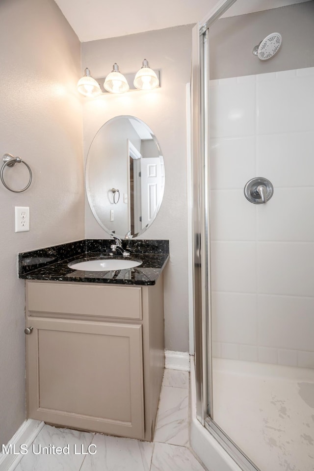 2421 Beachview Dr Unit H2, Ocean Springs, MS 39564 - full bathroom with marble finish floors, a stall shower, vanity, and baseboards