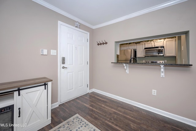2421 Beachview Dr Unit H2, Ocean Springs, MS 39564 - entrance foyer featuring baseboards, dark wood-type flooring, and ornamental molding