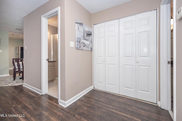 2421 Beachview Dr Unit H2, Ocean Springs, MS 39564 - corridor with dark wood-style flooring and baseboards