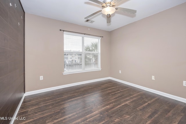 2421 Beachview Dr Unit H2, Ocean Springs, MS 39564 - spare room featuring dark wood-style flooring, baseboards, and ceiling fan