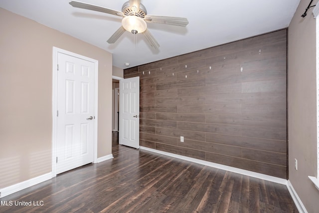 2421 Beachview Dr Unit H2, Ocean Springs, MS 39564 - unfurnished bedroom featuring wood finished floors, baseboards, and a ceiling fan