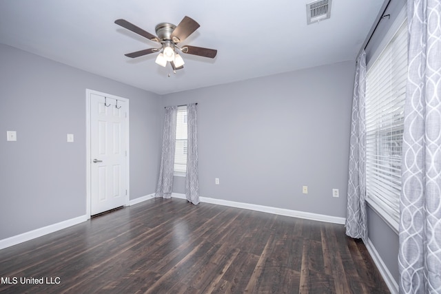 2421 Beachview Dr Unit H2, Ocean Springs, MS 39564 - unfurnished bedroom with multiple windows, wood finished floors, and baseboards