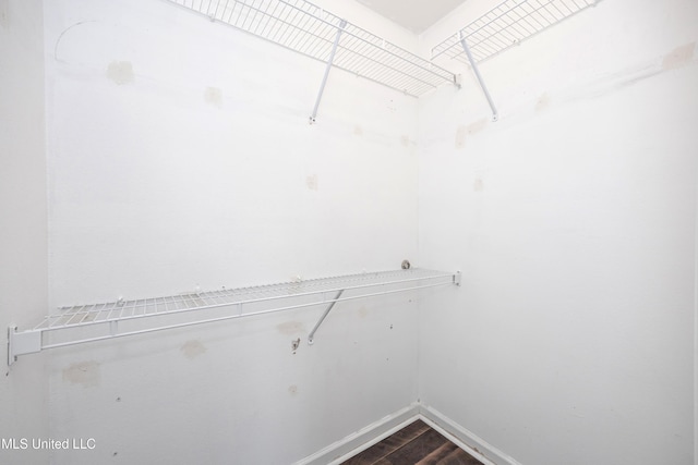2421 Beachview Dr Unit H2, Ocean Springs, MS 39564 - walk in closet featuring dark wood-style floors