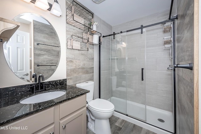 2421 Beachview Dr Unit H2, Ocean Springs, MS 39564 - full bath featuring a stall shower, toilet, vanity, and wood finished floors
