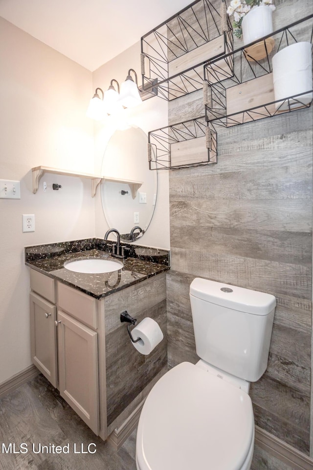 2421 Beachview Dr Unit H2, Ocean Springs, MS 39564 - bathroom featuring toilet, vanity, and baseboards
