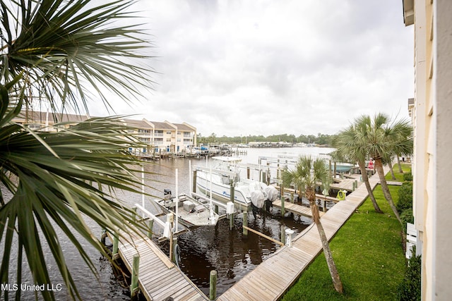 2421 Beachview Dr Unit H2, Ocean Springs, MS 39564 - dock with boat lift, a water view, and a lawn