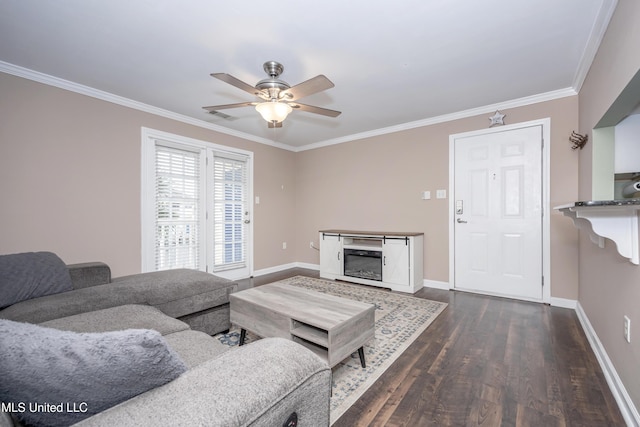 2421 Beachview Dr Unit H2, Ocean Springs, MS 39564 - living area featuring dark wood-style flooring, a ceiling fan, ornamental molding, baseboards, and a glass covered fireplace