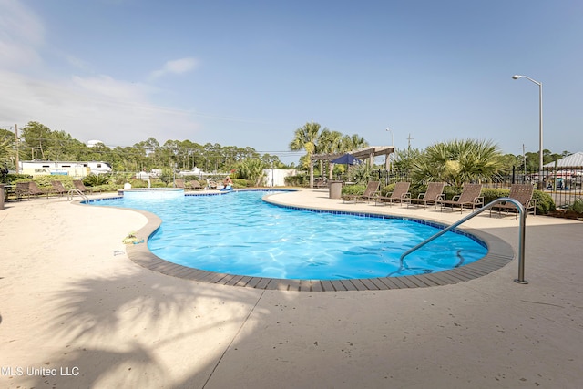 2421 Beachview Dr Unit H2, Ocean Springs, MS 39564 - community pool with fence, a patio, and a pergola