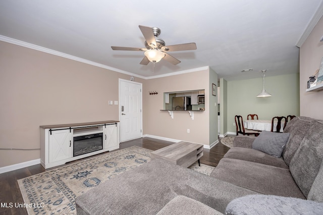 2421 Beachview Dr Unit H2, Ocean Springs, MS 39564 - living room featuring dark wood finished floors, ceiling fan, baseboards, and crown molding