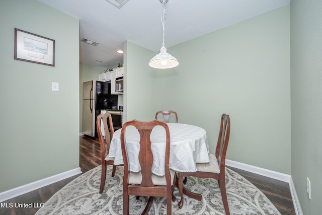 2421 Beachview Dr Unit H2, Ocean Springs, MS 39564 - dining space featuring baseboards, dark wood-type flooring, and recessed lighting