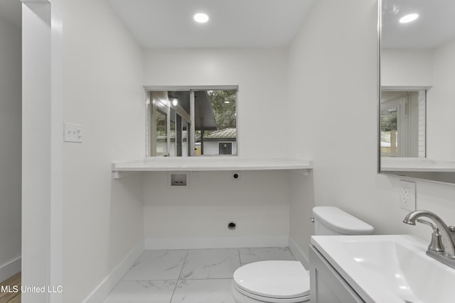 bathroom featuring toilet and vanity