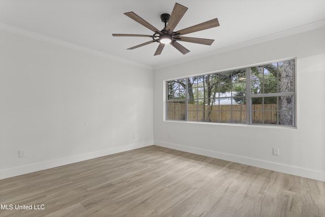 empty room with ornamental molding, ceiling fan, and light hardwood / wood-style flooring