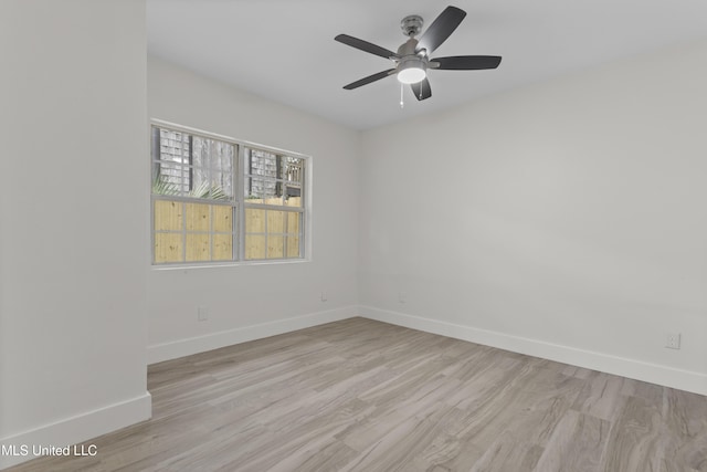 spare room with ceiling fan and light hardwood / wood-style flooring