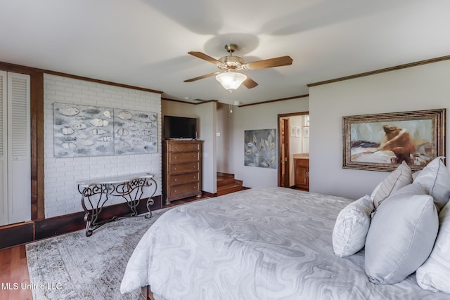 435 Christi Ln, Biloxi, MS 39531 - bedroom featuring ornamental molding, wood finished floors, ceiling fan, and ensuite bathroom