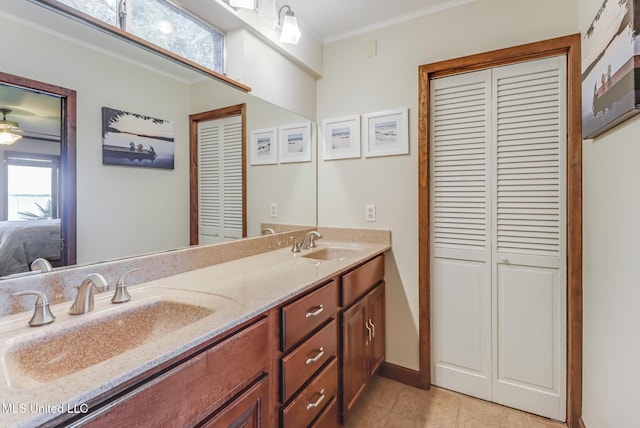 435 Christi Ln, Biloxi, MS 39531 - full bathroom featuring a closet, ensuite bathroom, double vanity, ornamental molding, and tile patterned floors