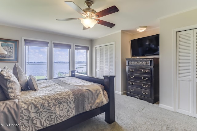 435 Christi Ln, Biloxi, MS 39531 - bedroom with carpet, ornamental molding, multiple closets, and ceiling fan
