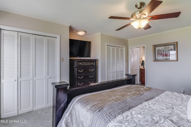 435 Christi Ln, Biloxi, MS 39531 - bedroom featuring multiple closets, crown molding, carpet flooring, and ceiling fan