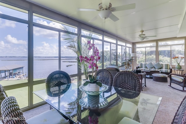 435 Christi Ln, Biloxi, MS 39531 - sunroom with carpet floors, a water view, and expansive windows