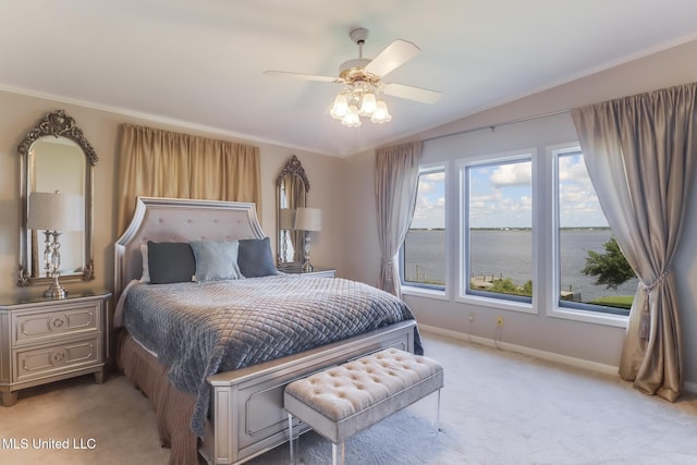 435 Christi Ln, Biloxi, MS 39531 - bedroom with light colored carpet, ceiling fan, and a water view