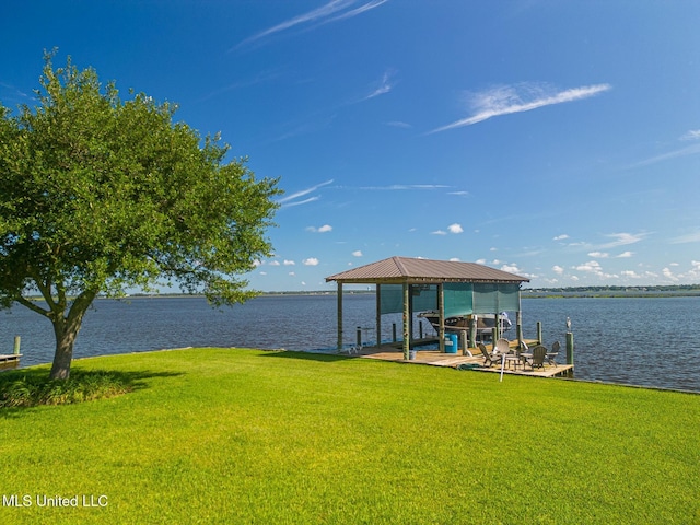 435 Christi Ln, Biloxi, MS 39531 - dock with boat lift, a lawn, and a water view