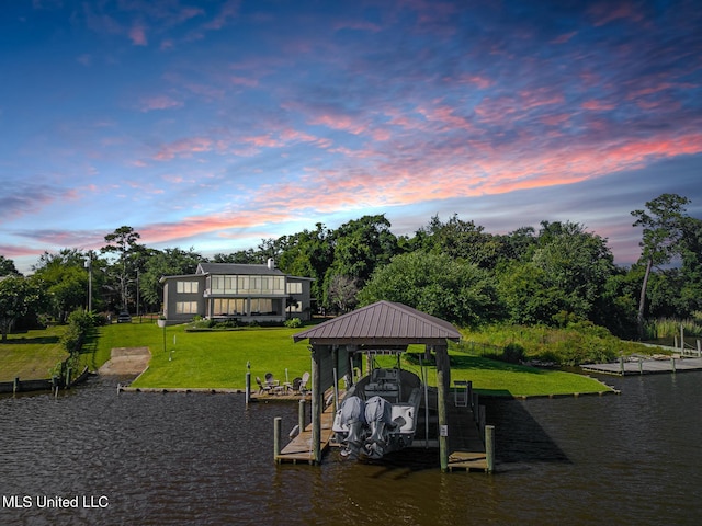 435 Christi Ln, Biloxi, MS 39531 - dock featuring a water view, a lawn, and boat lift