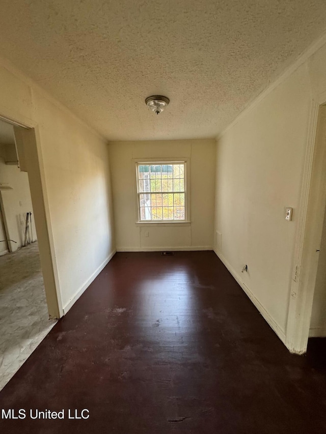 spare room featuring a textured ceiling