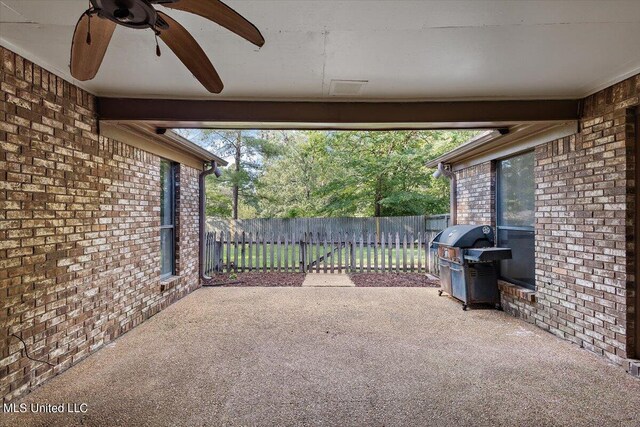 view of patio / terrace with fence, grilling area, and a ceiling fan