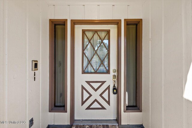 property entrance with board and batten siding