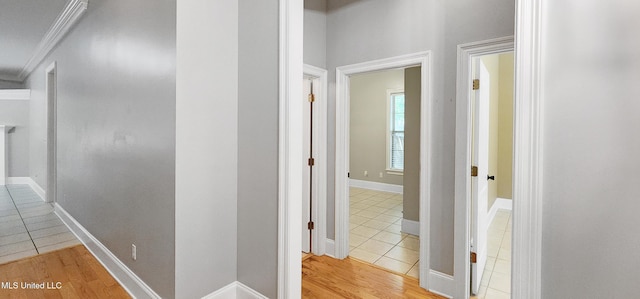682 Hilo Way, Diamondhead, MS 39525 - hall featuring tile patterned flooring and crown molding