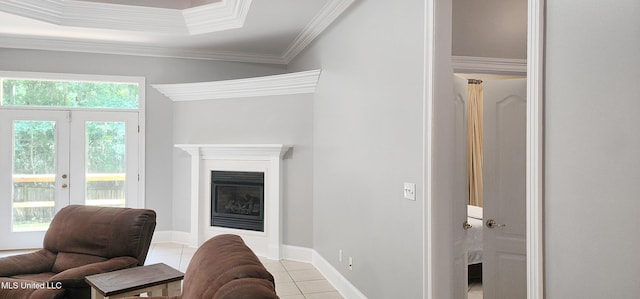 682 Hilo Way, Diamondhead, MS 39525 - living room featuring tile patterned floors, crown molding, french doors, and a fireplace