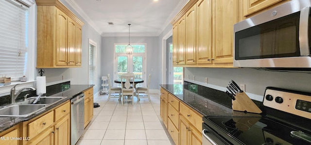 682 Hilo Way, Diamondhead, MS 39525 - kitchen with appliances with stainless steel finishes, light brown cabinets, light tile patterned flooring, crown molding, and dark stone counters
