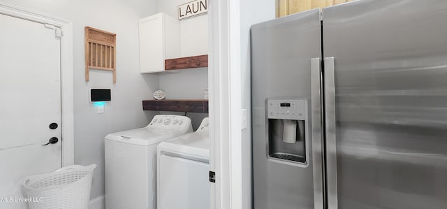 682 Hilo Way, Diamondhead, MS 39525 - washroom with washer and dryer and cabinet space