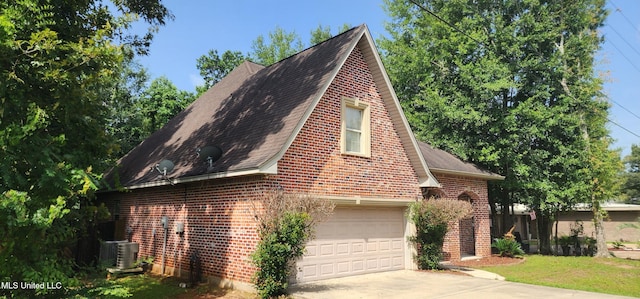682 Hilo Way, Diamondhead, MS 39525 - view of side of home with brick siding, concrete driveway, a garage, and a shingled roof