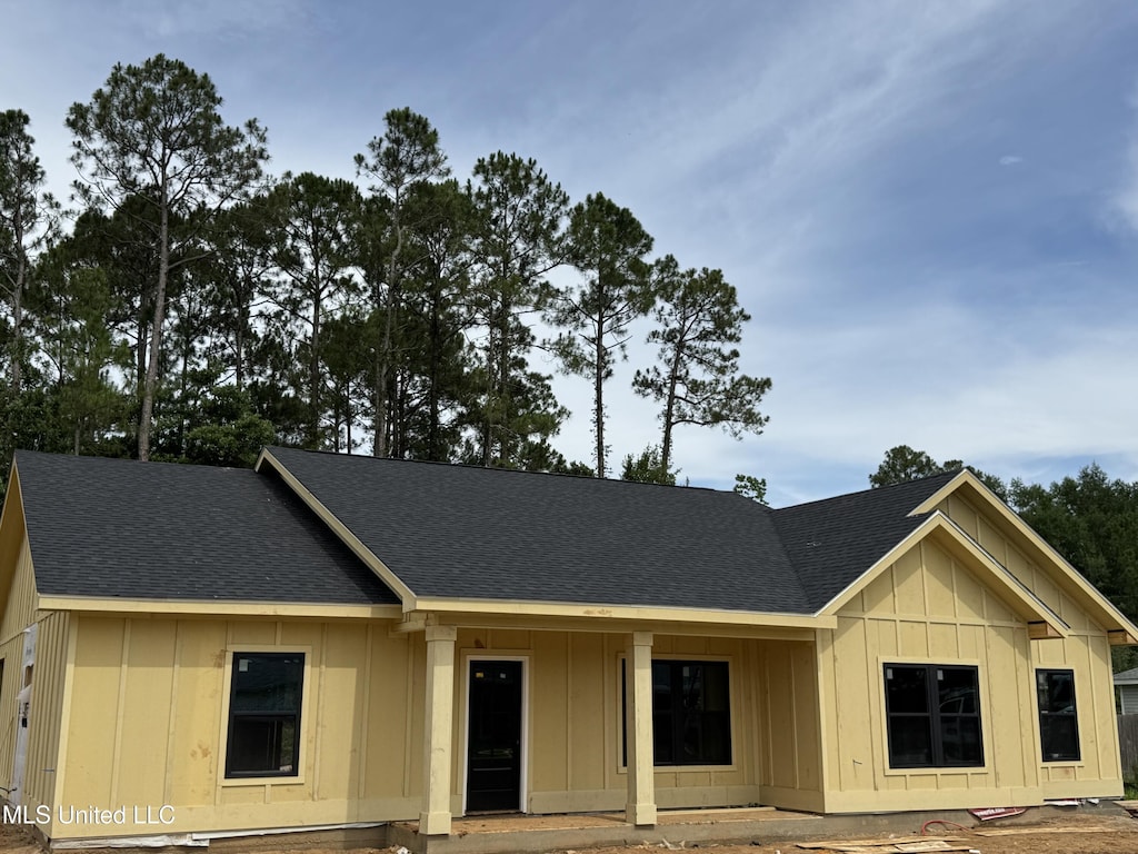832 Combel St, Waveland, MS 39576 - view of front of home featuring board and batten siding and roof with shingles