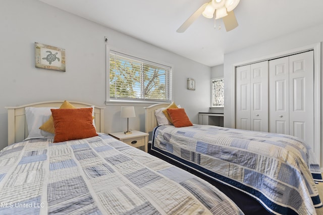 bedroom with ceiling fan and a closet