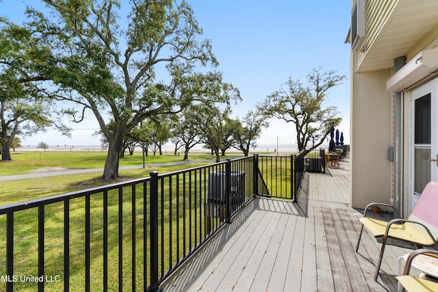 wooden deck with a yard