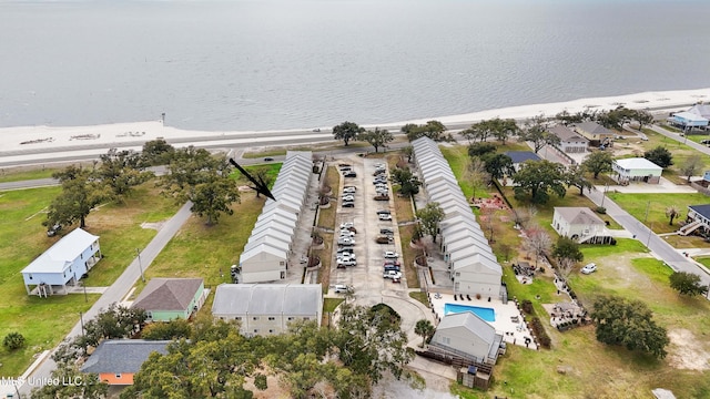 birds eye view of property featuring a water view and a residential view