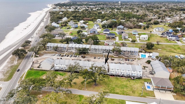 aerial view with a water view, a residential view, and a view of the beach