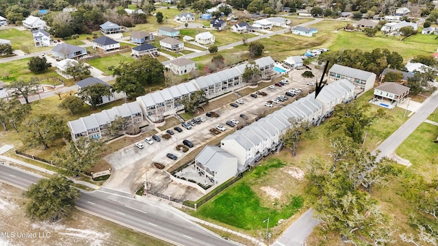 birds eye view of property with a residential view