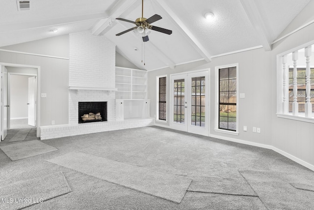 unfurnished living room with carpet flooring, french doors, a brick fireplace, a textured ceiling, and ceiling fan