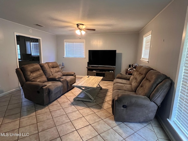 206 Shields Ave, Pelahatchie, MS 39145 - living area with light tile patterned floors, a ceiling fan, ornamental molding, healthy amount of natural light, and baseboards